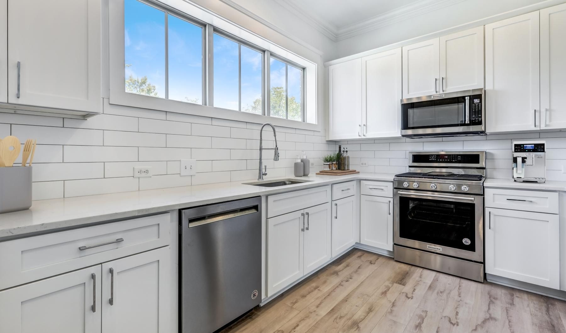 a kitchen with white cabinets